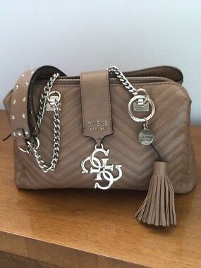 Guess Violet Small Girlfriend Satchel 4G Logo Closure & Tassel Charm in Tan